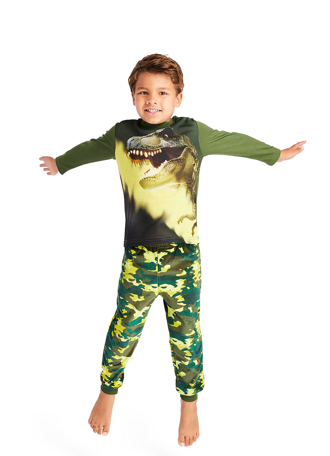 Little boy jumping and wearing Pajama Set with print T-Rex Dino plus Camo pants in green colour 