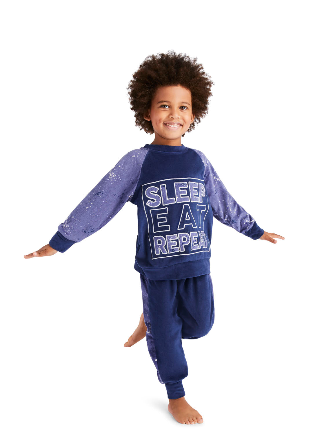 Fun Little Boy wearing a Blue Splatter Pajama Set