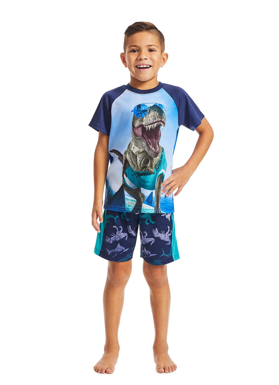 Boy wearing Dino pajama set, t-shirt and shorts