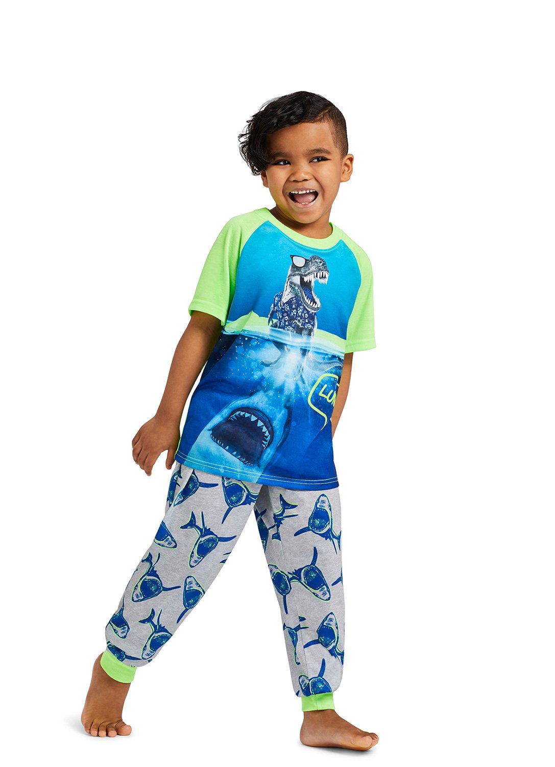 Kid smiling wearing Shark Puff Print Top & Jogger PantsShark Puff Print Top & Jogger Pants