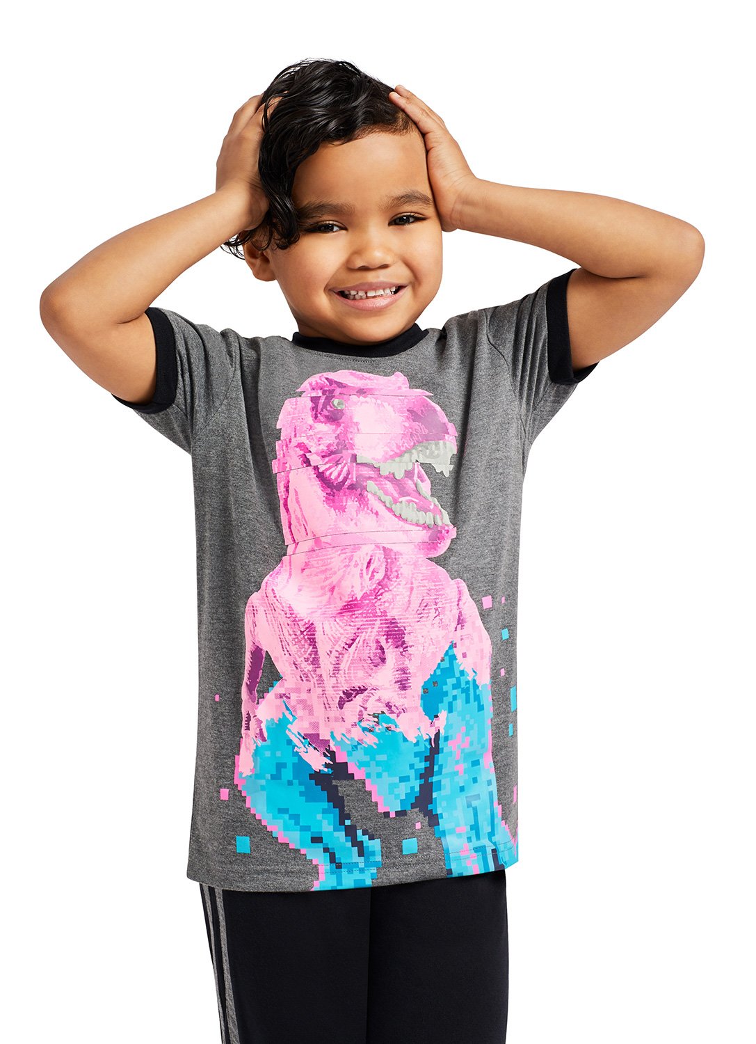 Smiling Kid with T-Rex Dino Print Top and Jogger Pants
