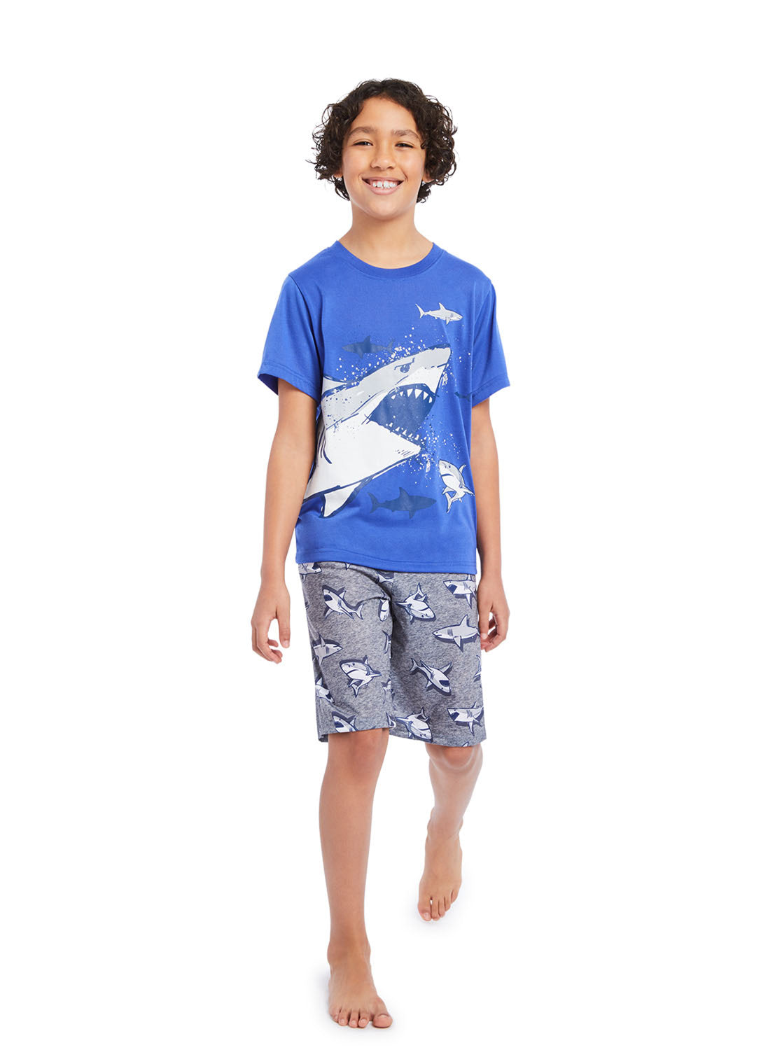 Boy wearing Shark t-shirt print and shorts with sharks print
