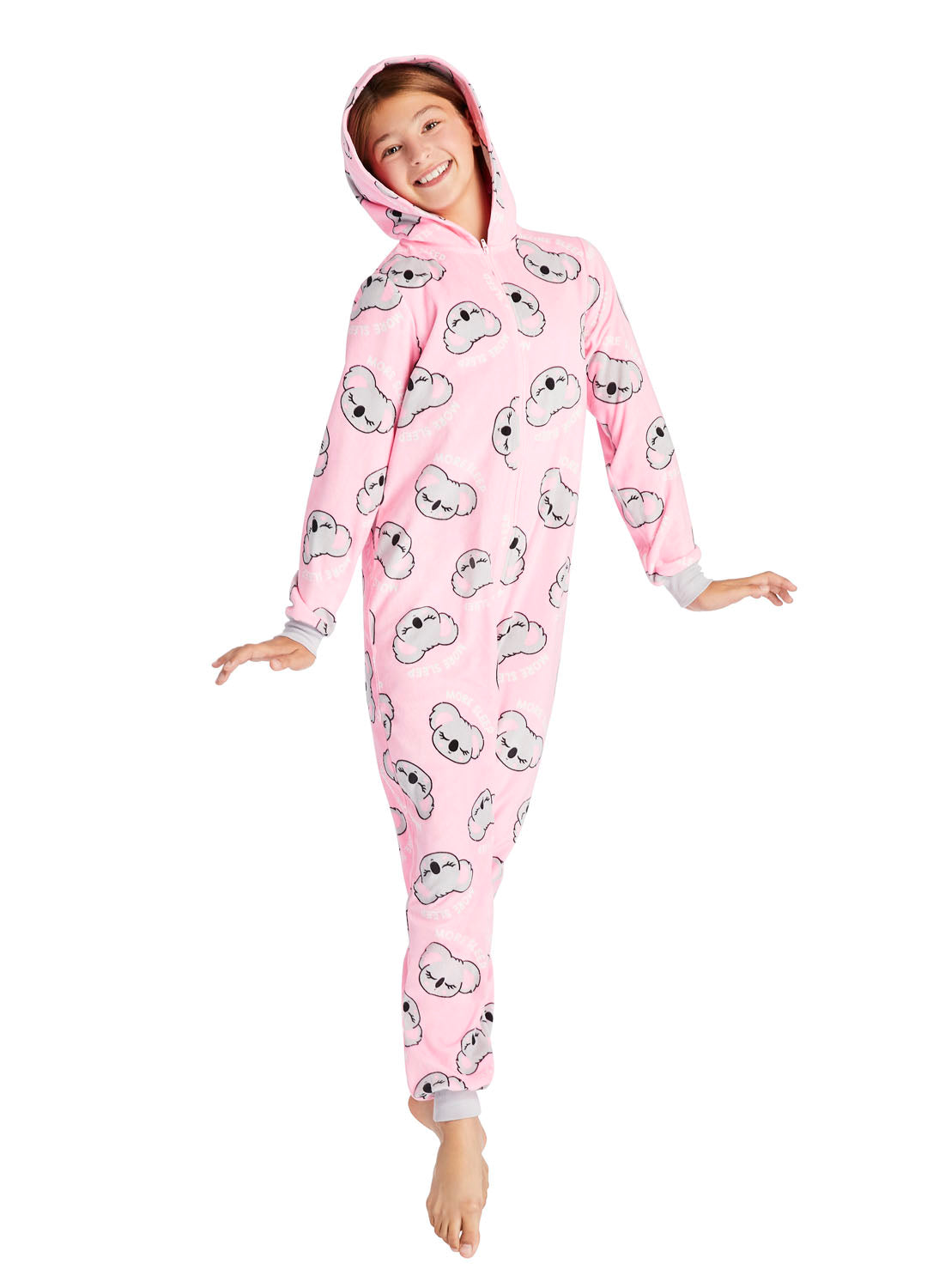 Teen girl jumping and wearing a Koala Print Onesie in Pink colour