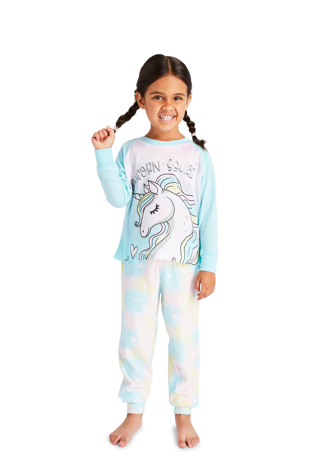 Little girl wearing pajama set with Unicorn print