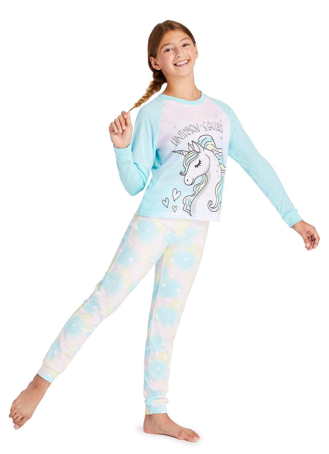 Teen girl wearing pajama set with Unicorn print
