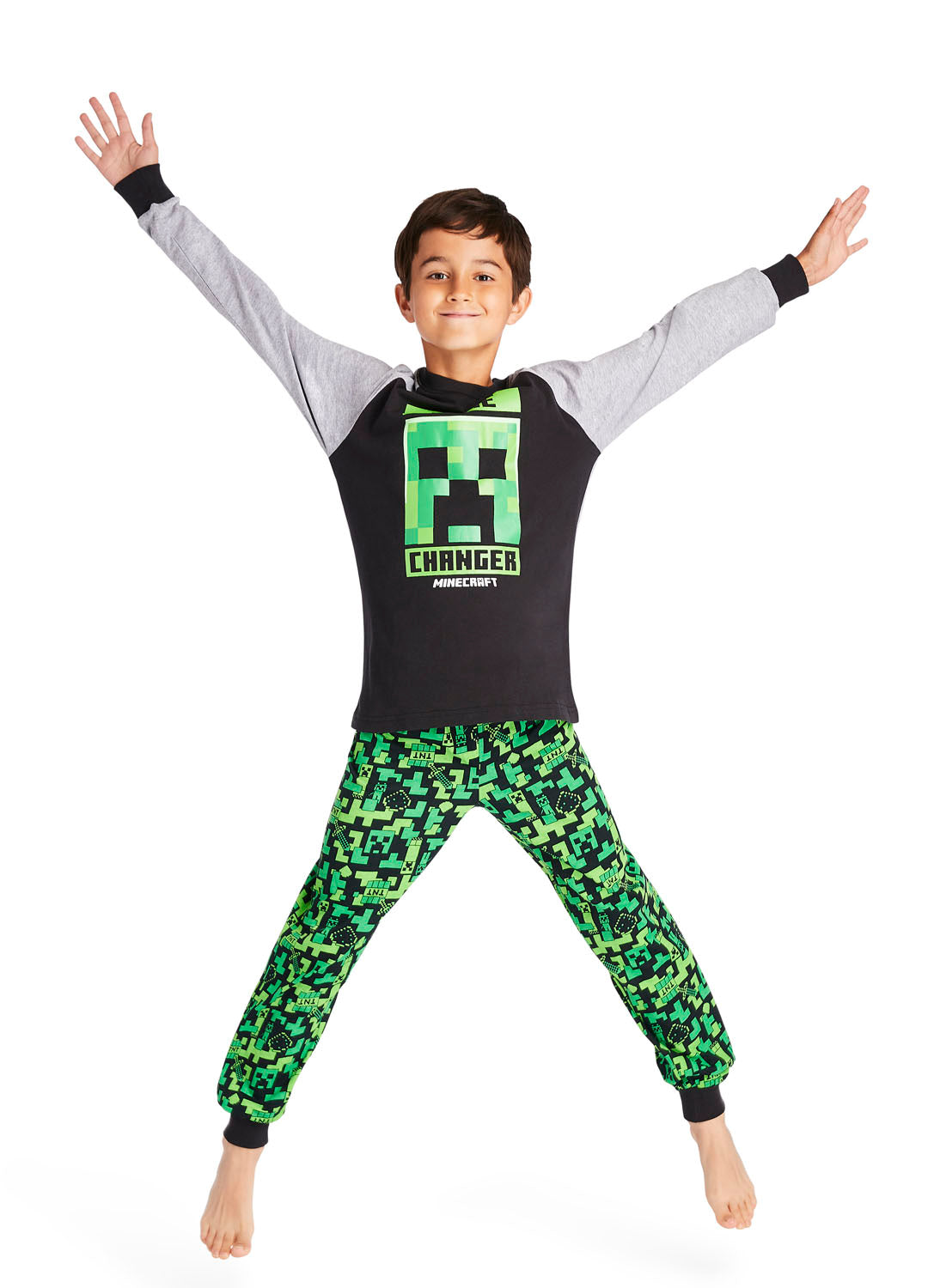 Boy jumping and wearing Minecraft print Pajama Set 