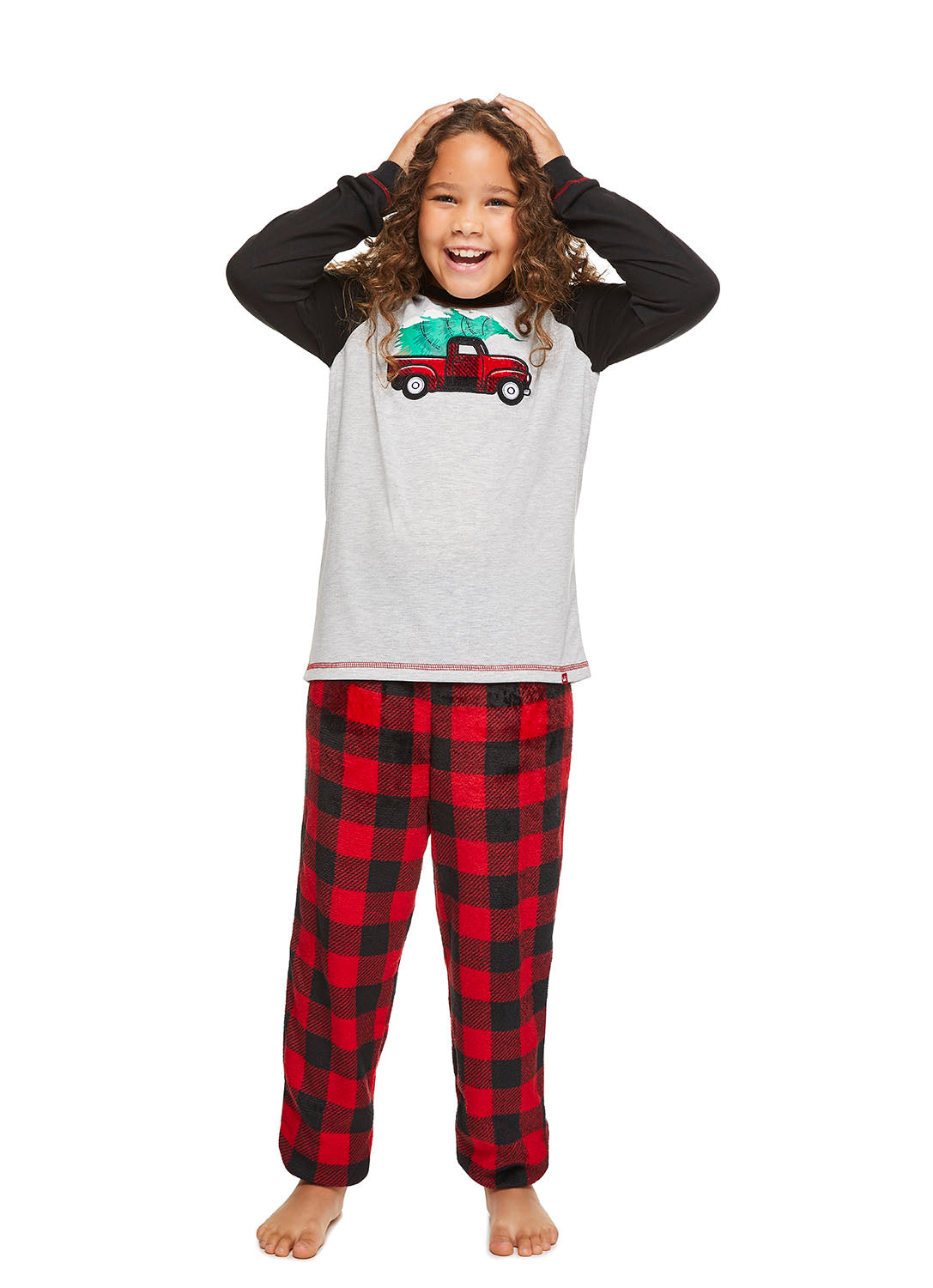 Girl wearing Red Truck Pajama Set