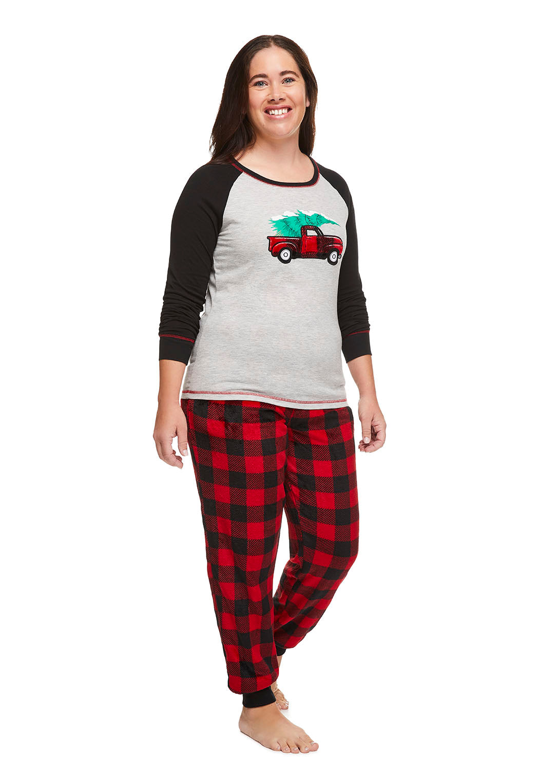 Woman smiling and wearing Red Truck Family Sleepwear Pajama Set
