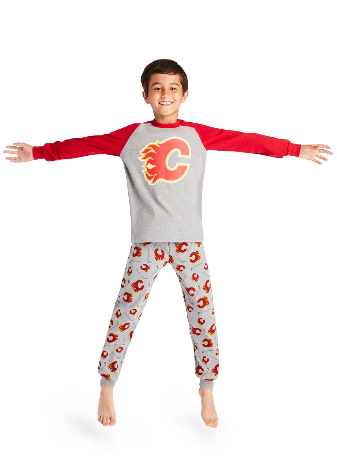 Boy jumping and wearing Calgary Flames Pajama Set